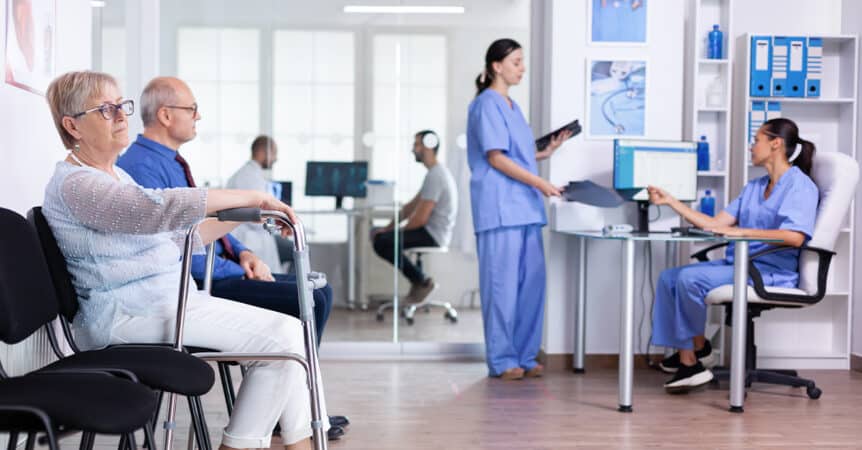 Senior woman and man in a medical waiting room with chronic conditions and Medicare